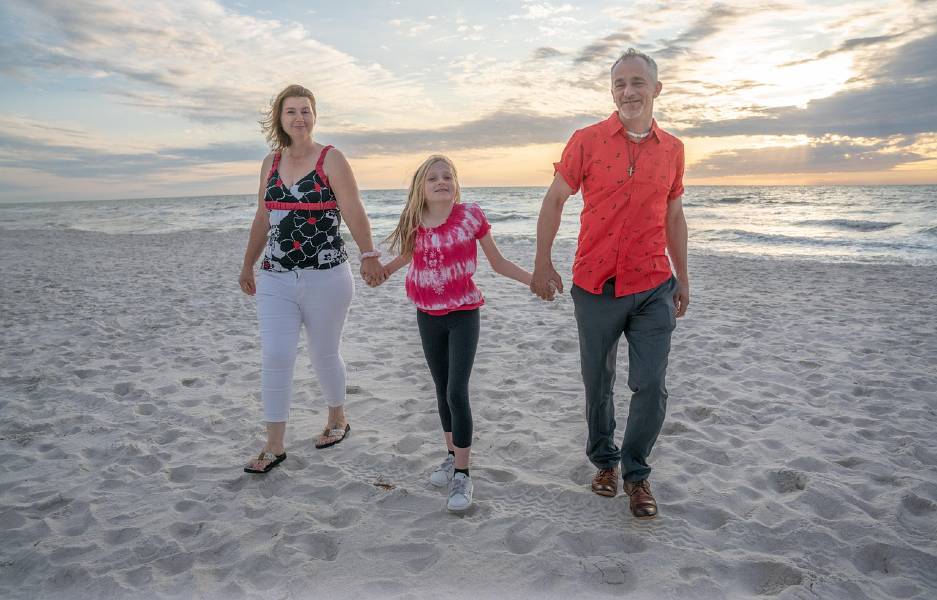 family on beach in summer